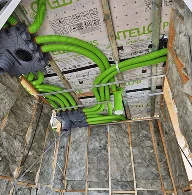 Energy-efficient home ventilation system with green ducting installed by Coy’s Constructions in Croydon.