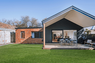 blackburn | Coy's Constructions blackburn Contemporary home extension with gable roof, black and brick exterior finishes, and spacious outdoor entertaining area, designed by Coy's Constructions in Australia.